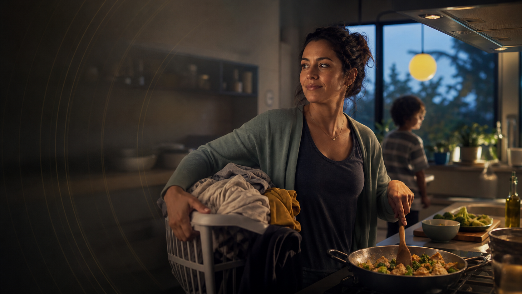 A woman cooking dinner while carrying laundry at home